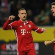 Bayern Munich's midfielder Thomas Mueller (R) celebrates a goal on March 19, 2017