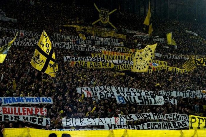 Supporters of Borussia Dortmund display banners during their match at home against Leipzig on February 4, 2017
