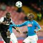Besiktas' forward from Cameroon Vincent Aboubakar (C) scores in front of Napoli's defender from France Kalidou Koulibaly during the UEFA Champions League football match SSC Napoli vs Besiktas on October 19, 2016
