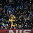Arsenal's Theo Walcott (L) celebrates scoring with teammate Alexis Sanchez during their English Premier League football match against Manchester City