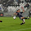 Monaco's Colombian forward Radamel Falcao (L) shoots to score a goal against Bordeaux at the Matmut Atlantique Stadium in Bordeaux, southwestern France, on December 10, 2016