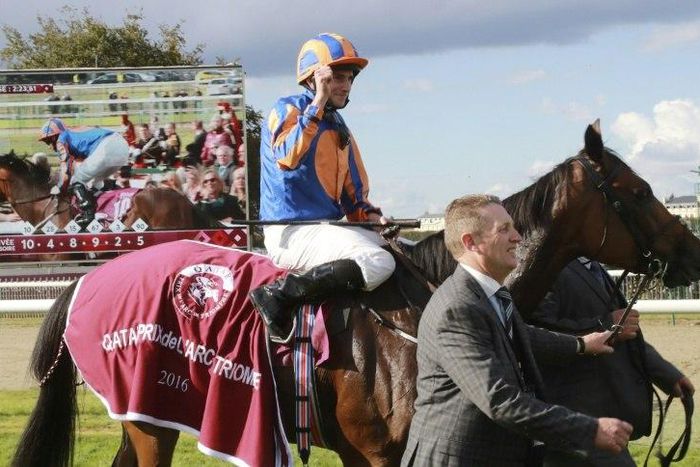 Britain's Ryan-Lee Moore on his horse 'Found' celebrates winning the 95th Prix de l'Arc de Triomphe horse race at the Chantilly racecourse, northern France, on October 2, 2016