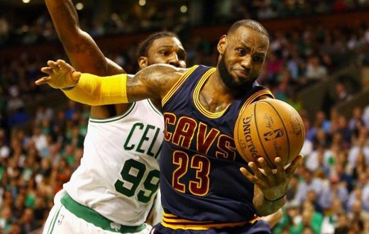 LeBron James of the Cleveland Cavaliers battles for the ball with Jae Crowder of the Boston Celtics in Game Two of the 2017 NBA Eastern Conference finals, at TD Garden in Boston, Massachusetts, on May 19