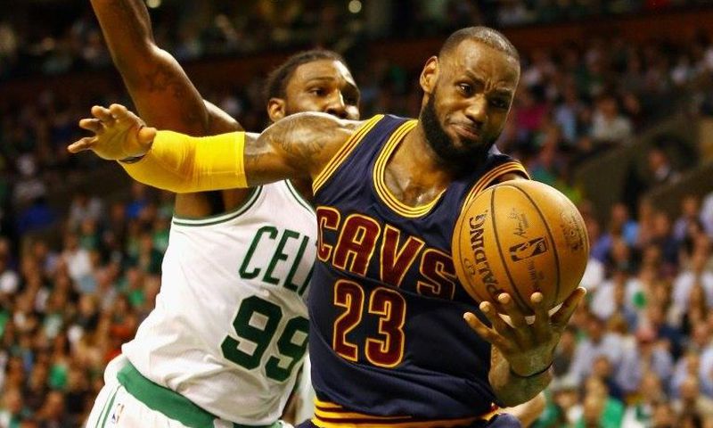 LeBron James of the Cleveland Cavaliers battles for the ball with Jae Crowder of the Boston Celtics in Game Two of the 2017 NBA Eastern Conference finals, at TD Garden in Boston, Massachusetts, on May 19