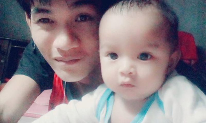 Wuttisan Wongtalay and the infant.