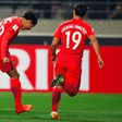 South Korea's Hong Jeong-Ho (left) celebrates his goal against Syria in a World Cup qualifier in Seoul on March 28, 2017