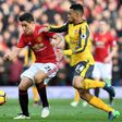 Manchester United's Spanish midfielder Ander Herrera (L) vies with Arsenal's French midfielder Francis Coquelin during the English Premier League football match between Manchester United and Arsenal on November 19, 2016