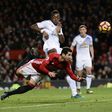 Manchester United's midfielder Henrikh Mkhitaryan (C) strikes the ball with the back of his heel to score their third goal during the English Premier League football match against Sunderland December 26, 2016