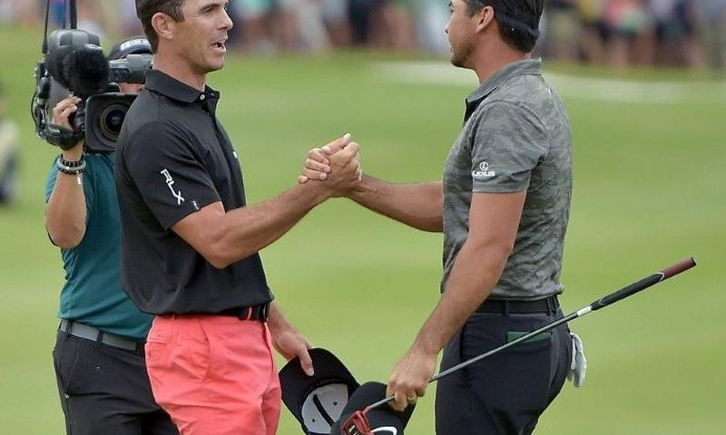 Billy Horschel shakes hands with Jason Day after beating him in a playoff during the Final Round of the Byron Nelson