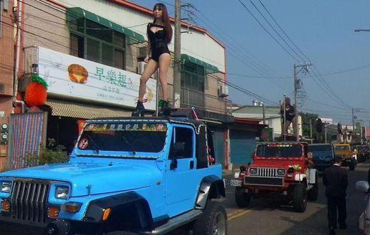 The dancers were part of huge funeral procession for local councillor Tung Hsian
