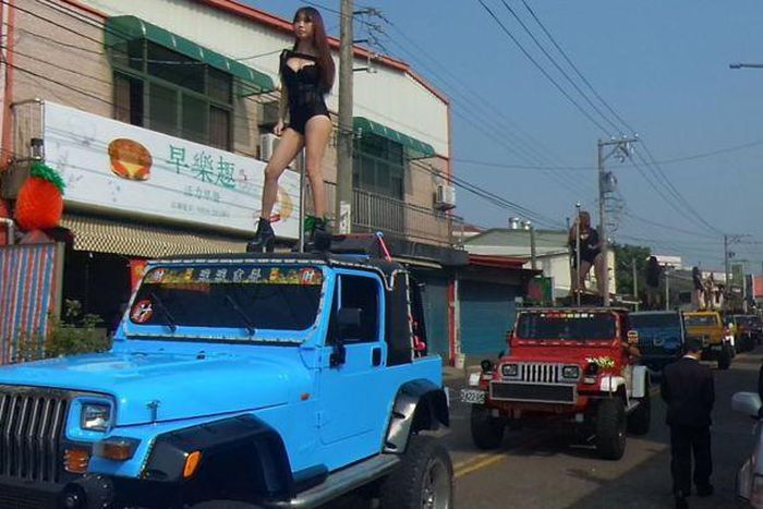 The dancers were part of huge funeral procession for local councillor Tung Hsian