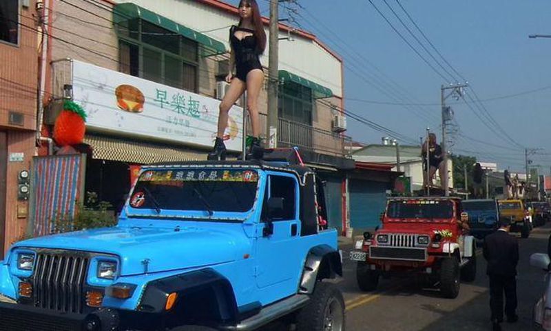 The dancers were part of huge funeral procession for local councillor Tung Hsian