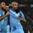 Manchester City's Sergio Aguero (C) celebrates with teammates Raheem Sterling (L) and Fernandinho after scoring a goal during their English Premier League match against Bournemouth, at the Vitality Stadium in Bournemouth, on February 13, 2017
