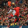 Watford's midfielder Valon Behrami (L) jumps for the ball against Liverpool's midfielder Sadio Mane on November 6, 2016