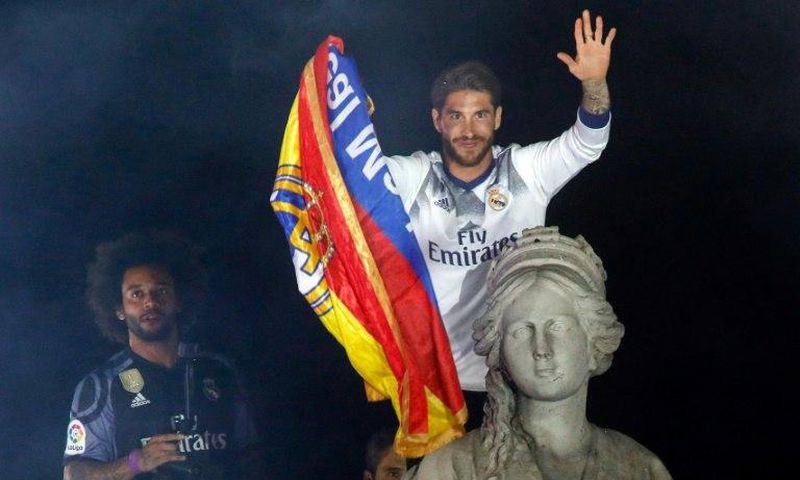 Real Madrid's captain Sergio Ramos (R) and defender Marcelo celebrate the team's La Liga title, at the Plaza de Cibeles in Madrid, on May 21, 2017
