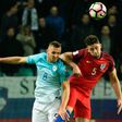 Slovenia's midfielder Jasmin Kurtic (L) vies for the ball with England's defender Gary Cahill (R) during the Fifa World Cup 2018 football qualification match between Slovenia and England on October 11, 2016
