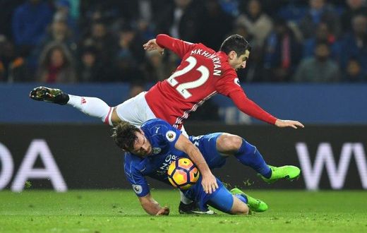 Leicester City's defender Christian Fuchs vies with Manchester United's midfielder Henrikh Mkhitaryan during the English Premier League football match between Leicester City and Manchester United on February 5, 2017