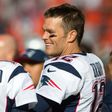 Quarterbacks Jimmy Garoppolo and Tom Brady of the New England Patriots talk on the sidelines against the Cleveland Browns, in Cleveland, Ohio, on October 9, 2016