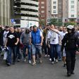 Legia Warsaw football fans are escorted by Spanish police into stadium ahead of the match between Real Madrid and Legia Warszawa at the Santiago Bernabeu stadium in Madrid on October 18, 2016