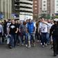 Legia Warsaw football fans are escorted by Spanish poilce into the stadium to take their seats ahead of the UEFA Champions League football match Real Madrid CF vs Legia Legia Warszawa at the Santiago Bernabeu stadium in Madrid on October 18, 2016