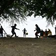 Children play football close to Caira beach in the commune of Leogane, south-west of Port-au-Prince