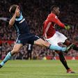 Manchester United's midfielder Paul Pogba (R) attemps to shoot past Middlesbrough's defender George Friend during the English Premier League football match at Old Trafford in Manchester, north west England, on December 31, 2016