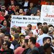 Fans hold up banners calling for a managerial change at Arsenal on May 21, 2017