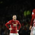 Manchester United's striker Wayne Rooney (L) anmd Manchester United's Swedish striker Zlatan Ibrahimovic react during the English Premier League football match against Hull City February 1, 2017