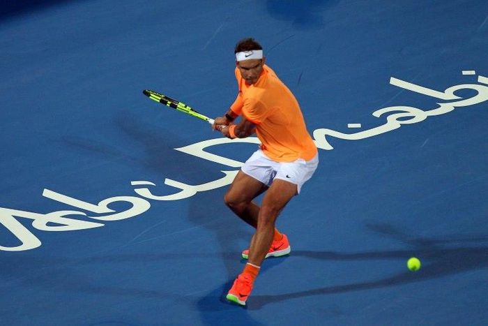 Spain's Rafael Nadal returns the ball to Czech's Tomas Berdych during the Mubadala World Tennis Championship in Abu Dhabi on December 29, 2016