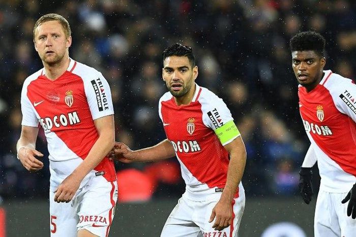 (from L) Monaco's Kamil Glik, Radamel Falcao and Jemerson keep their eye on the ball during the match against Paris Saint-Germain in Paris on January 29, 2017