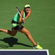 Elena Vesnina of Russia plays a backhand against Svetlana Kuznetsova of Russia on March 19, 2017 in Indian Wells, California