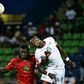 Burkina Faso's forward Bertrand Traore (R) challenges Guinea-Bissau's forward Piqueti during the 2017 Africa Cup of Nations group A football match between Guinea-Bissau and Burkina Faso in Franceville on January 22, 2017