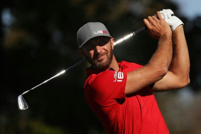 Dustin Johnson of the United States hits off the 13th tee during morning foursome matches of the 2016 Ryder Cup at Hazeltine National Golf Club on September 30, 2016 in Chaska, Minnesota