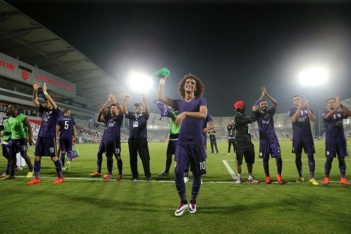 Al-Ain's Omar Abdulrahman (C) and teammates celebrate at the end of their Asian Champions League football match against Qatar's El-Jaish on October 18, 2016 in Doha