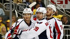 Andre Burakovsky (L) celebrates scoring against the Pittsburgh Penguins as the Washington Capitals win 5-2