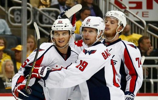 Andre Burakovsky (L) celebrates scoring against the Pittsburgh Penguins as the Washington Capitals win 5-2
