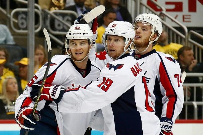 Andre Burakovsky (L) celebrates scoring against the Pittsburgh Penguins as the Washington Capitals win 5-2
