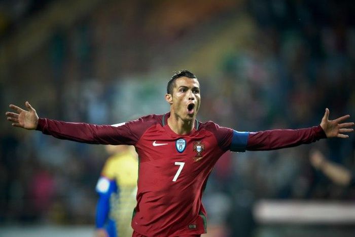 Portugal's forward Cristiano Ronaldo celebrates after scoring a goal during the WC 2018 football qualification match between Portugal and Andorra at the Municipal de Arouca stadium in Aveiro on October 7, 2016