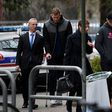 Grenoble's Irish centre Chris Farrell (2ndL) and Grenoble's Irish prop Denis Coulson (R) arrive on March 21, 2017 at the police station in Grenoble, French Alps