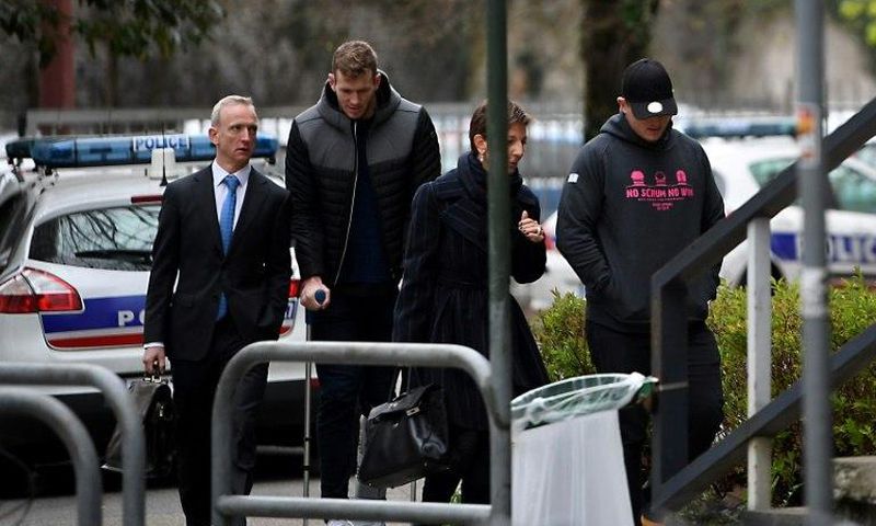 Grenoble's Irish centre Chris Farrell (2ndL) and Grenoble's Irish prop Denis Coulson (R) arrive on March 21, 2017 at the police station in Grenoble, French Alps