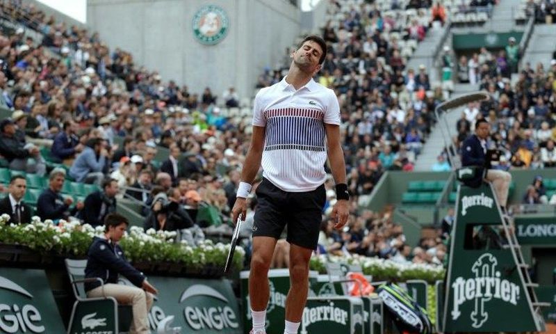 Serbia's Novak Djokovic reacts during his tennis match against Austria's Dominic Thiem at the French Open on June 7, 2017
