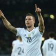Germany's midfielder Lukas Podolski reacts after scoring during a friendly football match against England on March 22, 2017