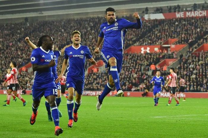 Chelsea's striker Diego Costa (C) celebrates scoring their second goal with midfielder Victor Moses (L) and defender Marcos Alonso (2ndL) on October 30, 2016