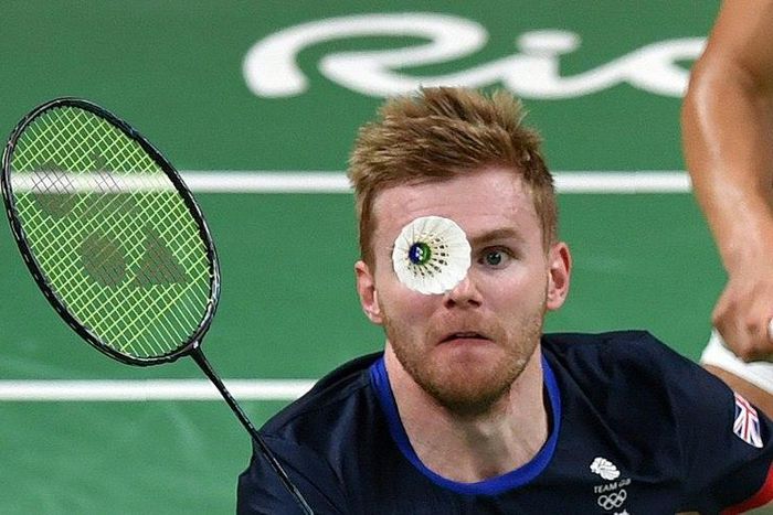 Great Britain's Marcus Ellis hits a shuttle during the Rio Olympics badminton tournament