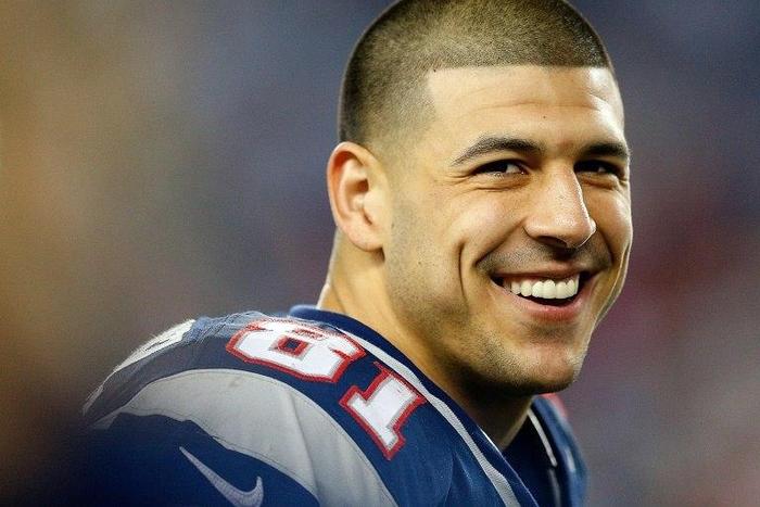 Former New England Patriots tight end Aaron Hernandez, pictured in December 2012, is currently serving a life sentence in prison without parole for murdering Odin Lloyd, a semi-pro football player in June 2013