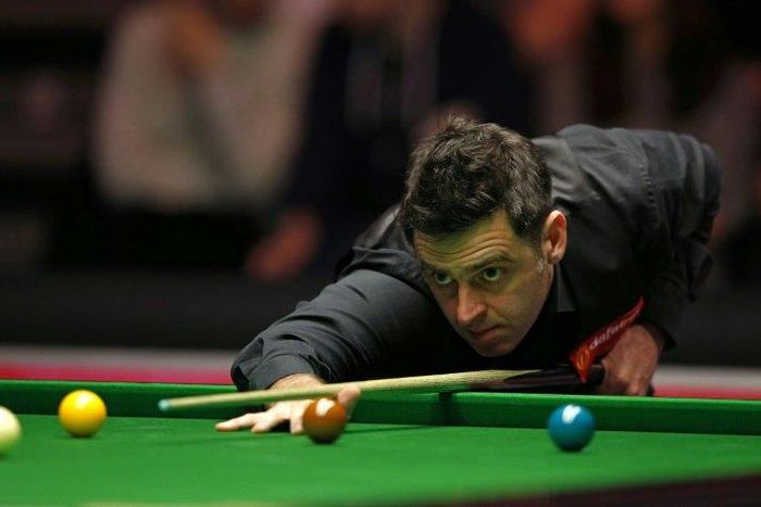 England's Ronnie O'Sullivan plays a shot during his first round match against China's Liang Wenbo during the Masters Snooker tournament at Alexandra Palace in London, on January 15, 2017