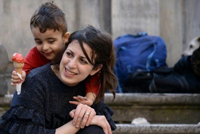 Syrians Nour and her son Riad are among the 12 refugees taken in by Pope Francis from a refugee camp a year ago