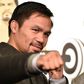 WBO welterweight world champion Manny Pacquiao poses for the media following a press conference at his boxing gym in Tokyo on November 25, 2016