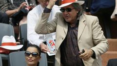 According to reports, Romanian former tennis player Ilie Nastase (R), pictured in June 2013, swore at the umpire, then Britain's pregnant captain Anne Keothavong and their number one player Johanna Konta
