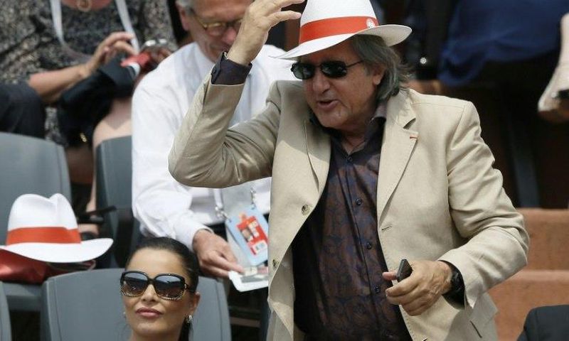 Romanian Fed Cup captain Ilie Nastase (C) has been suspended by the International Tennis Federation (ITF) over foul-mouthed and abusive behaviour during the tie against Britain